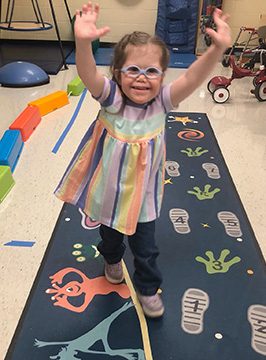 sensory Path in use with a smiling student
