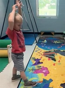 sensory path with a student doing dino yoga!