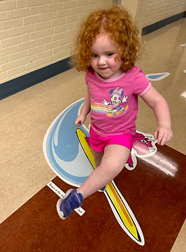 sensory path with a student pretending to surf