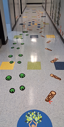 Students using sensory path with engaging movement activities in school hallway